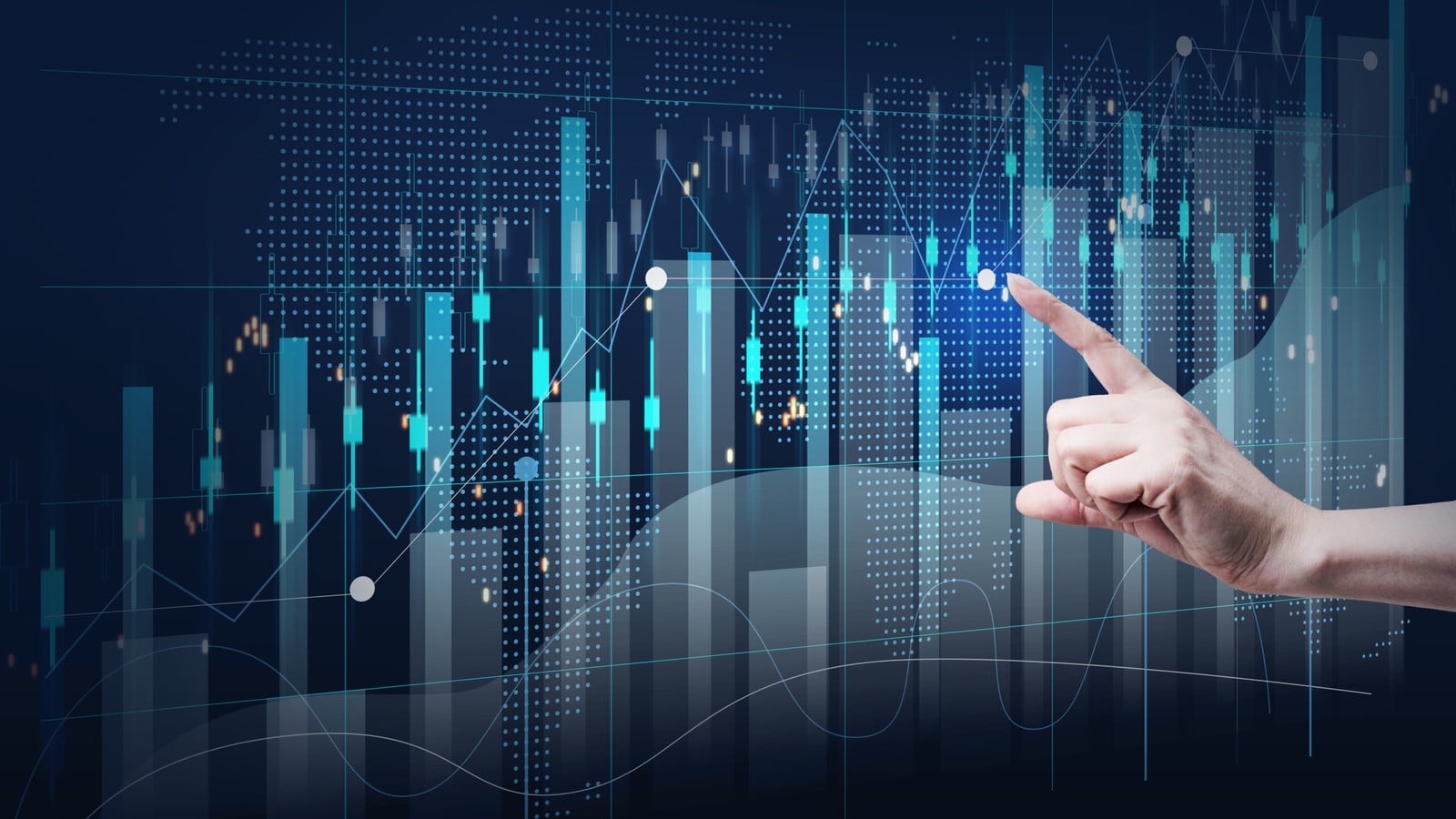 A hand touching a glowing chart of market data