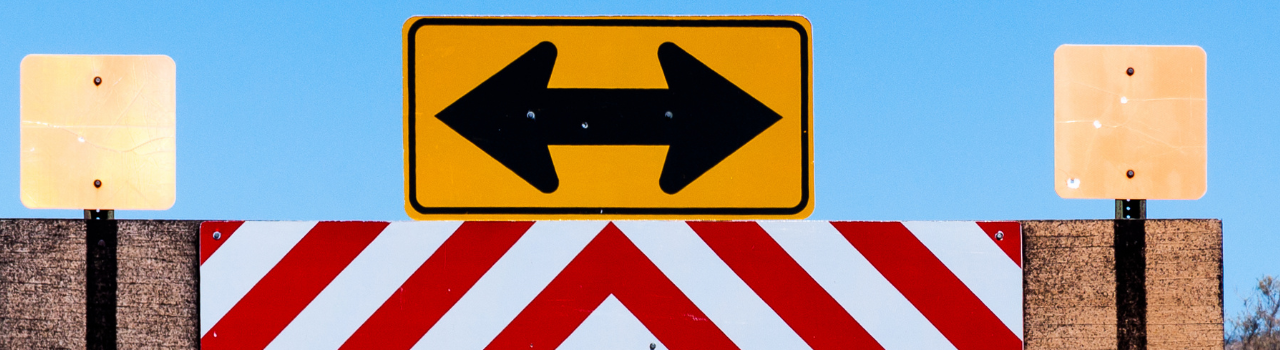 ACH or Crypto payments for dispensaries - which is better. A sign pointing in opposite directions